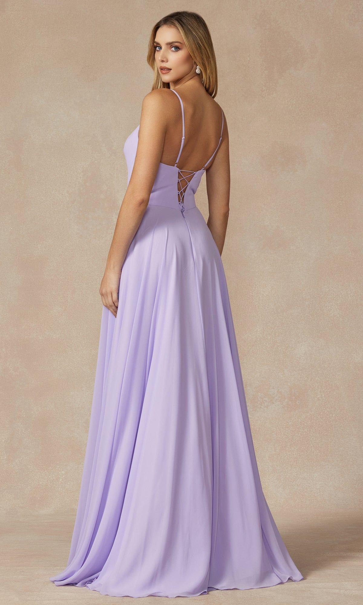 A woman models the Simple Long Formal Dress with Lace-Up Back 263 in lavender—a sleeveless, a-line gown with thin straps and lace-up back—standing against a neutral background, turned slightly away from the camera.
